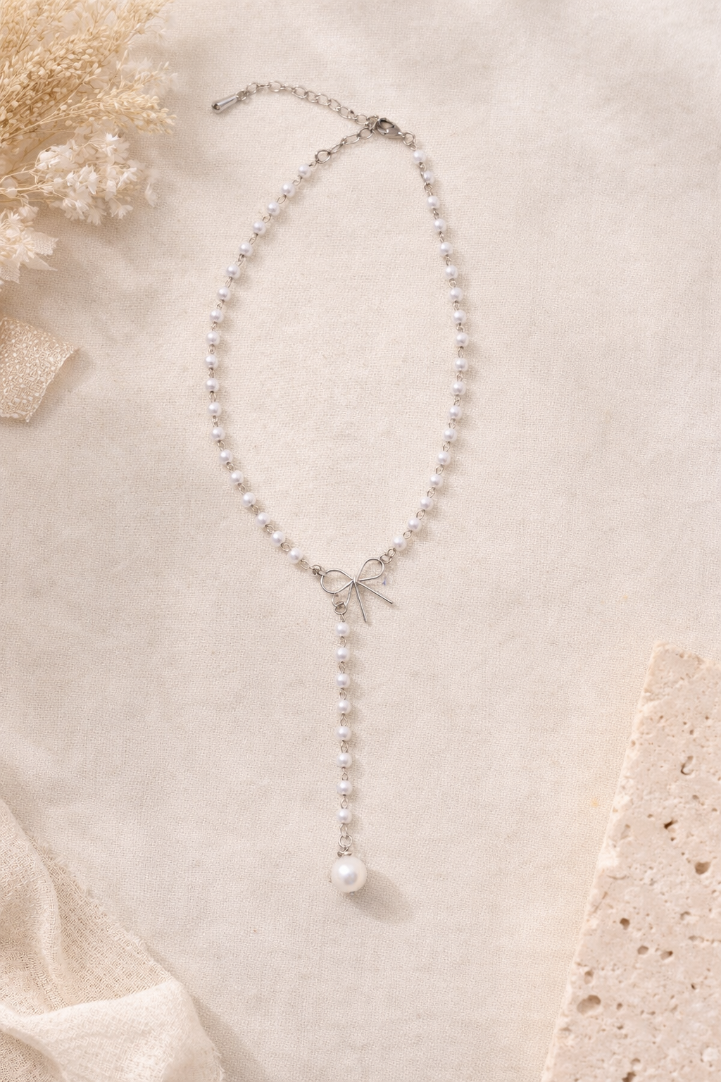 The Everly Pearl Bow Lariat Necklace